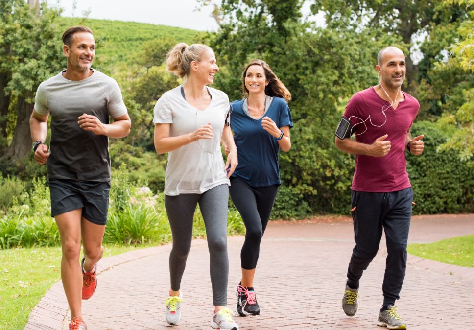 Group of people running outside for exercise